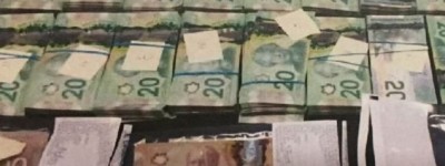 安省男子在自家车库地下埋藏超过120万加元现金全被没收